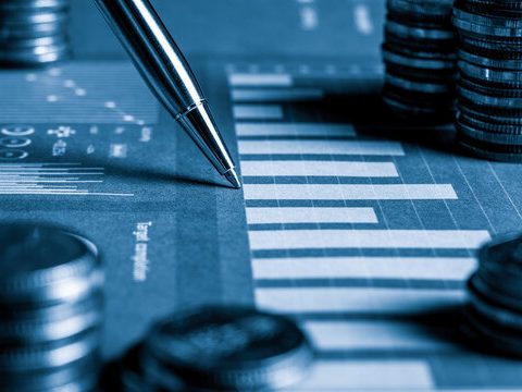 Financial growth chart with pen symbolising Echeva’s revenue and conversion optimisation for boutique hotels.